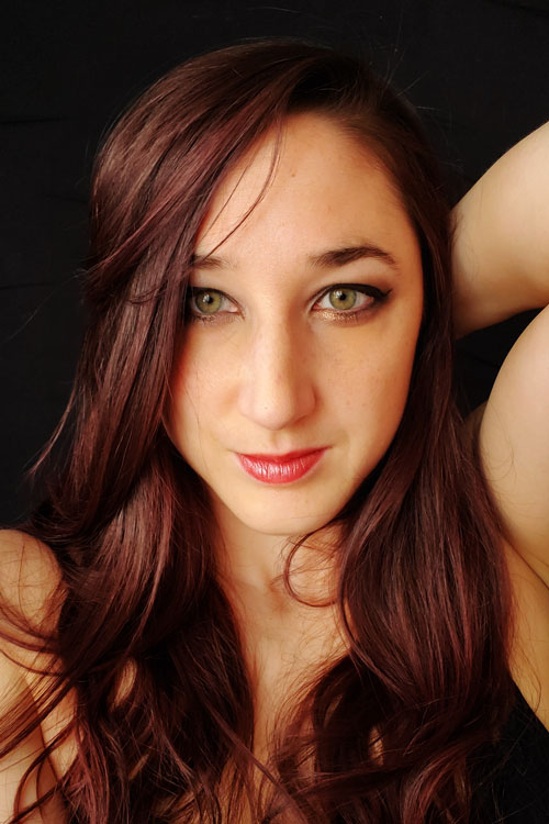 Close up portrait of artist and photographer Kelsey Byram.
