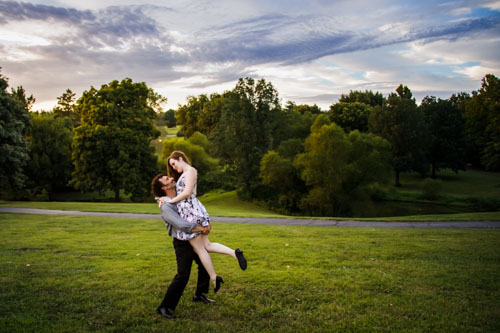 Playful engagement photo - outdoor Kansas City wedding photographer