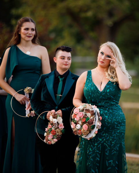 Emotional bridesmaids during ceremony - Kansas City candid wedding photography