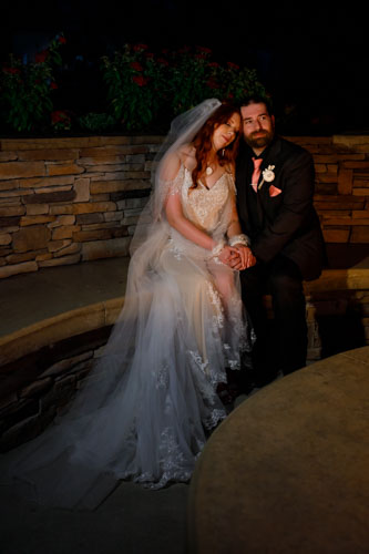 Romantic night wedding portrait in rose garden - Kansas City wedding photographer